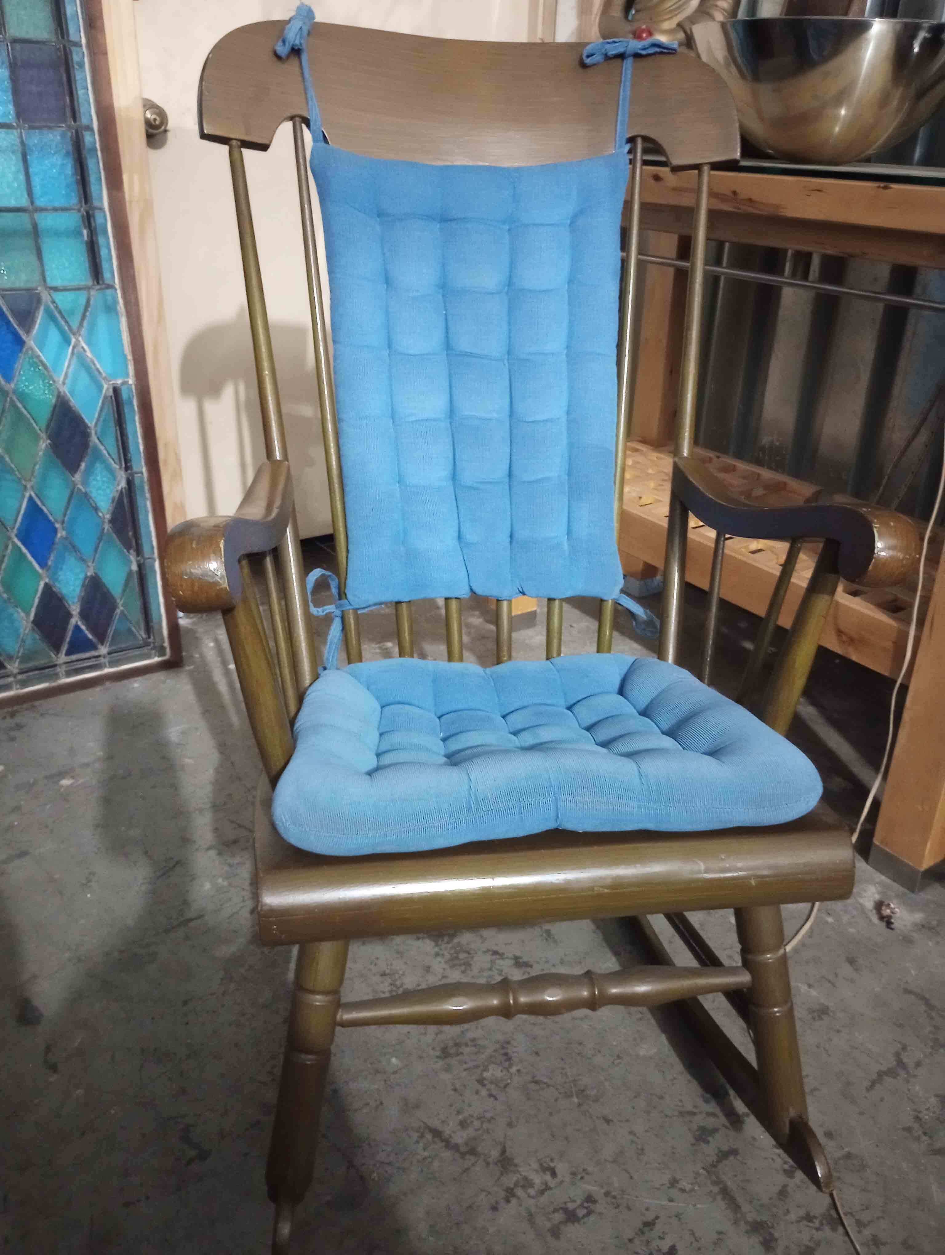 Wooden rocking chair with cushions