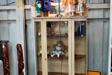 Vintage porcelain doll girl with blue eyes with flowing curly golden hair